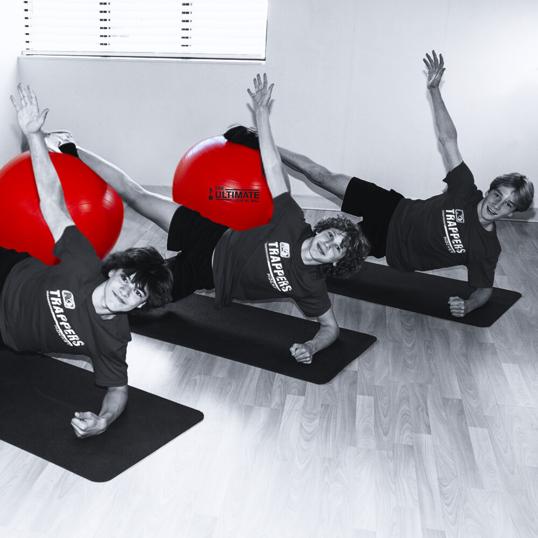Athletes using the Ultimate Exercise Ball for strength training and balance.